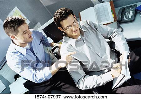 High angle view of two businessmen in an office View Large Photo Image Stock Photo - High angle view of two businessmen in an office. Fotosearch