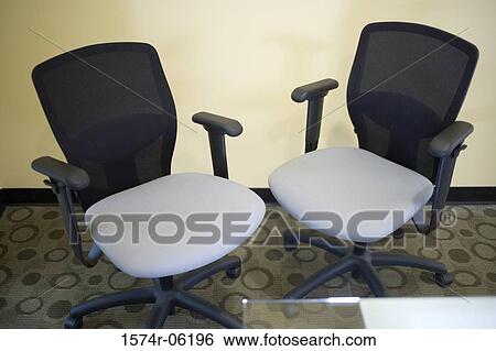 High angle view of two chairs and a table in an office View Large Photo Image Stock Photograph - High angle view of two chairs and a table in an office. Fotosearch