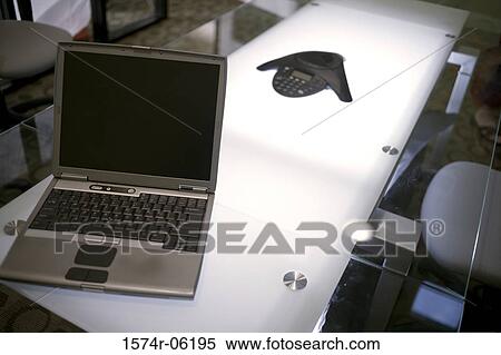 Laptop and a conference phone on the conference table View Large Photo Image Stock Photography - Laptop and a conference phone on the conference table. Fotosearch