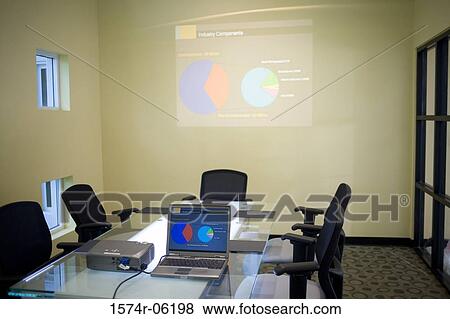 Stock Photo - Laptop and projection equipment in a conference room. Fotosearch