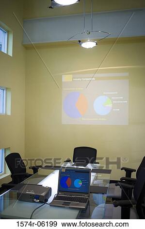 Stock Photo - Laptop and projection equipment in a conference room. Fotosearch