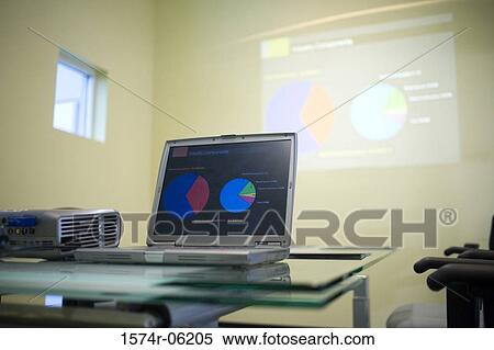 Stock Photography - Laptop and projection equipment in a conference room. Fotosearch
