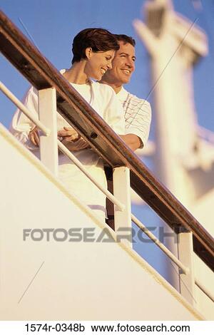 Low angle view of a young couple on a cruise ship View Large Photo Image Stock Image - Low angle view of a young couple on a cruise ship. Fotosearch