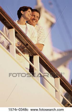Low angle view of a young couple on a cruise ship View Large Photo Image Stock Image - Low angle view of a young couple on a cruise ship. Fotosearch