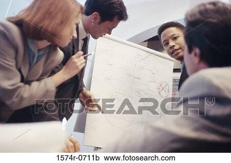 Low angle view of business executives in a meeting View Large Photo Image Stock Image - Low angle view of business executives in a meeting. Fotosearch