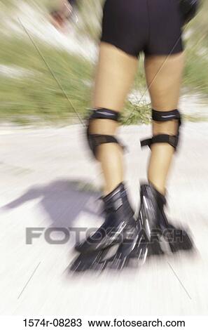 Low section view of a person wearing inline skates View Large Photo Image Stock Image - Low section view of a person wearing inline skates. Fotosearch