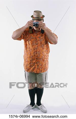 Picture - Man taking a photograph. Fotosearch