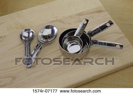 Stock Photo - Metal measuring cups. Fotosearch