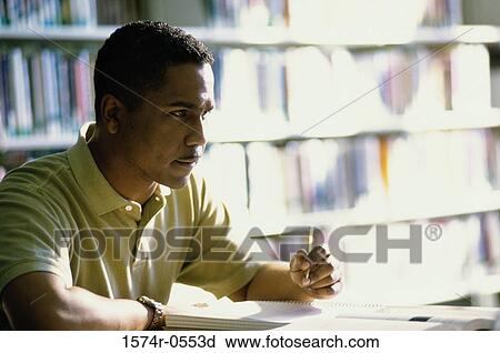Mid adult man holding a pencil View Large Photo Image Stock Image - Mid adult man holding a pencil. Fotosearch