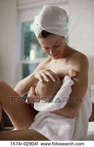Mother breastfeeding her baby boy View Large Photo Image Stock Image - Mother breastfeeding her baby boy. Fotosearch