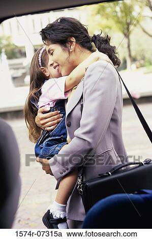 Mother holding her daughter View Large Photo Image Stock Image - Mother holding her daughter. Fotosearch