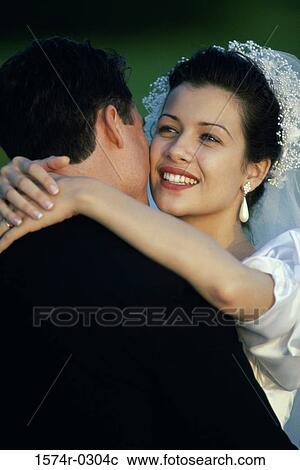 Newly married couple embracing each other View Large Photo Image Stock Image - Newly married couple embracing each other. Fotosearch