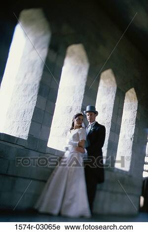 Newlywed couple embracing each other View Large Photo Image Stock Image - Newlywed couple embracing each other. Fotosearch