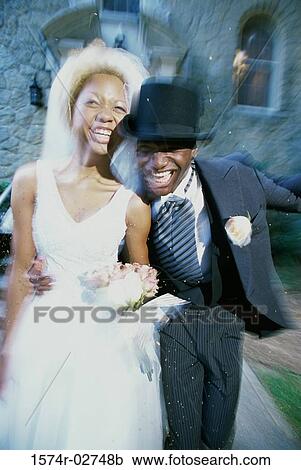 Newlywed couple running together View Large Photo Image Stock Image - Newlywed couple running together. Fotosearch