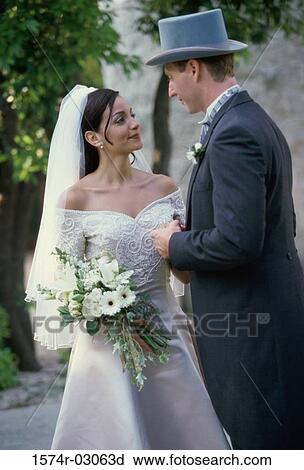 Stock Image - Newlywed couple smiling. Fotosearch
