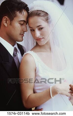 Newlywed couple standing together View Large Photo Image Stock Image - Newlywed couple standing together. Fotosearch