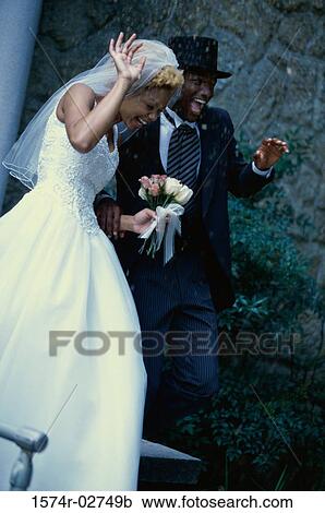 Newlywed couple walking together View Large Photo Image Stock Image - Newlywed couple walking together. Fotosearch