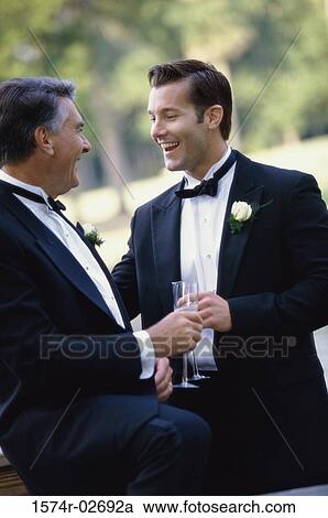 Newlywed young man with his father View Large Photo Image Stock Image - Newlywed young man with his father. Fotosearch