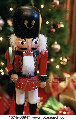Nutcracker soldier with a Christmas tree in the background View Large Photo Image Stock Photo - Nutcracker soldier with a Christmas tree in the background. Fotosearch