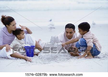 Parents with their son and daughter on the beach View Large Photo Image Stock Image - Parents with their son and daughter on the beach. Fotosearch