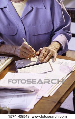 Person writing a check View Large Photo Image Stock Photo - Person writing a check. Fotosearch