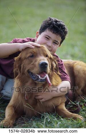 Portrait of a boy hugging his dog View Large Photo Image Stock Image - Portrait of a boy hugging his dog. Fotosearch