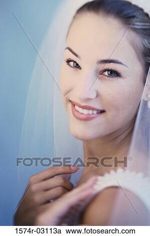 Stock Image - Portrait of a bride smiling. Fotosearch