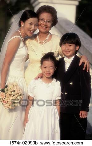 Stock Image - Portrait of a bride smiling with her mother. Fotosearch