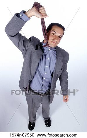 Portrait of a businessman hanging himself with his necktie View Large Photo Image Stock Image - Portrait of a businessman hanging himself with his necktie. Fotosearch