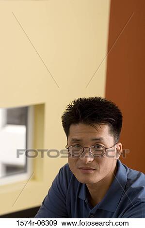 Portrait of a businessman in an office View Large Photo Image Stock Photo - Portrait of a businessman in an office. Fotosearch