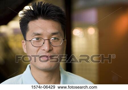 Portrait of a businessman in an office View Large Photo Image Stock Photo - Portrait of a businessman in an office. Fotosearch