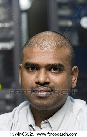 Stock Photography - Portrait of a businessman in an office. Fotosearch