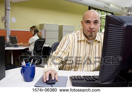 Portrait of a businessman sitting in an office View Large Photo Image Stock Image - Portrait of a businessman sitting in an office. Fotosearch