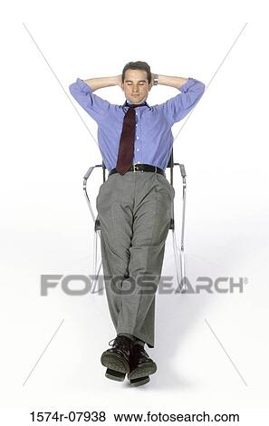 Portrait of a businessman sitting on a chair View Large Photo Image Stock Photo - Portrait of a businessman sitting on a chair. Fotosearch