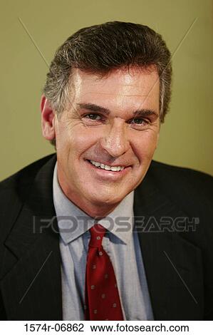 Portrait of a businessman smiling View Large Photo Image Stock Image - Portrait of a businessman smiling. Fotosearch