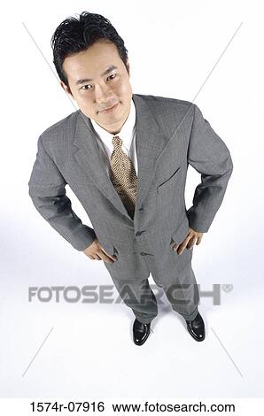 Stock Photograph - Portrait of a businessman smiling. Fotosearch