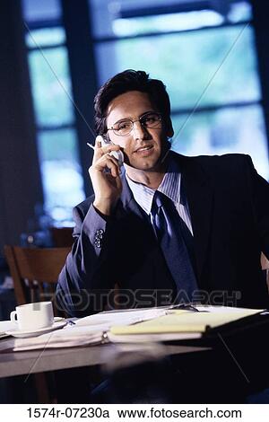 Portrait of a businessman talking on a mobile phone View Large Photo Image Stock Image - Portrait of a businessman talking on a mobile phone. Fotosearch
