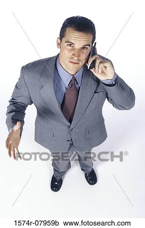 Portrait of a businessman talking on a mobile phone View Large Photo Image Stock Image - Portrait of a businessman talking on a mobile phone. Fotosearch