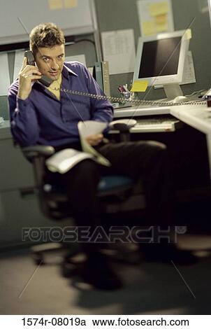 Portrait of a businessman talking on a landline telephone View Large Photo Image Stock Image - Portrait of a businessman talking on a landline telephone. Fotosearch