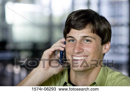Portrait of a businessman using a mobile phone in an office View Large Photo Image Stock Image - Portrait of a businessman using a mobile phone in an office. Fotosearch