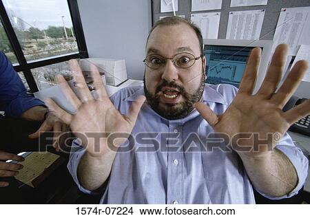 Picture - Portrait of a businessman with his arms in front. Fotosearch