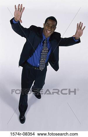 Picture - Portrait of a businessman with his hands raised. Fotosearch