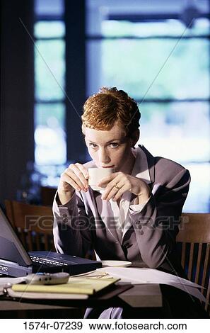 Portrait of a businesswoman drinking a cup of coffee View Large Photo Image Stock Photo - Portrait of a businesswoman drinking a cup of coffee. Fotosearch