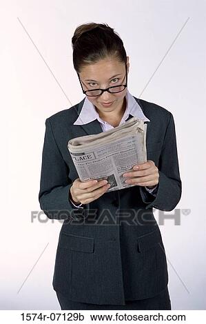 Portrait of a businesswoman holding a newspaper View Large Photo Image Stock Image - Portrait of a businesswoman holding a newspaper. Fotosearch