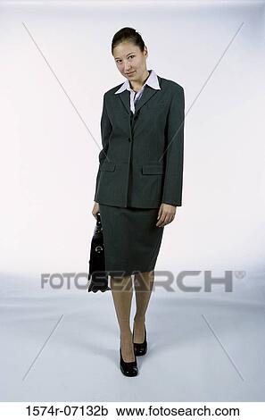 Portrait of a businesswoman holding a briefcase View Large Photo Image Stock Image - Portrait of a businesswoman holding a briefcase. Fotosearch