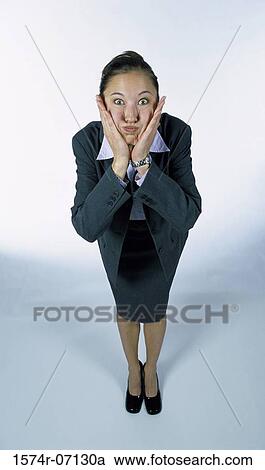 Stock Image - Portrait of a businesswoman making a face. Fotosearch