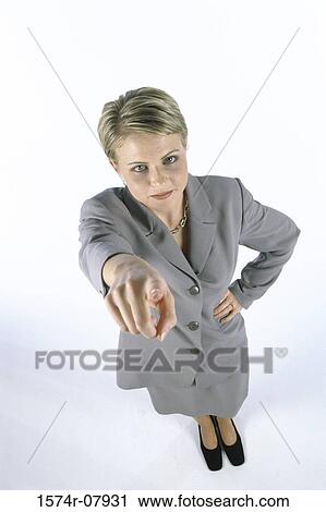 Stock Image - Portrait of a businesswoman pointing. Fotosearch