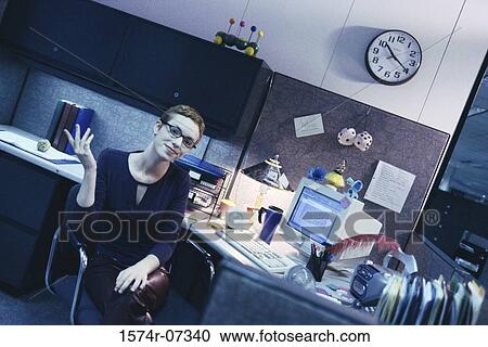 Portrait of a businesswoman sitting in an office smiling View Large Photo Image Stock Image - Portrait of a businesswoman sitting in an office smiling. Fotosearch