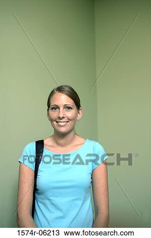 Portrait of a businesswoman smiling in an office View Large Photo Image Stock Image - Portrait of a businesswoman smiling in an office. Fotosearch