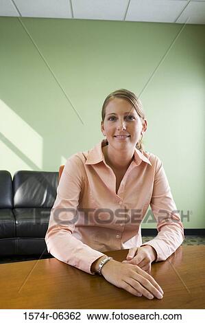 Portrait of a businesswoman smiling in an office View Large Photo Image Stock Image - Portrait of a businesswoman smiling in an office. Fotosearch